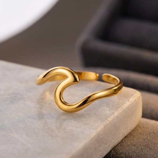 Gold-plated adjustable wave ring.