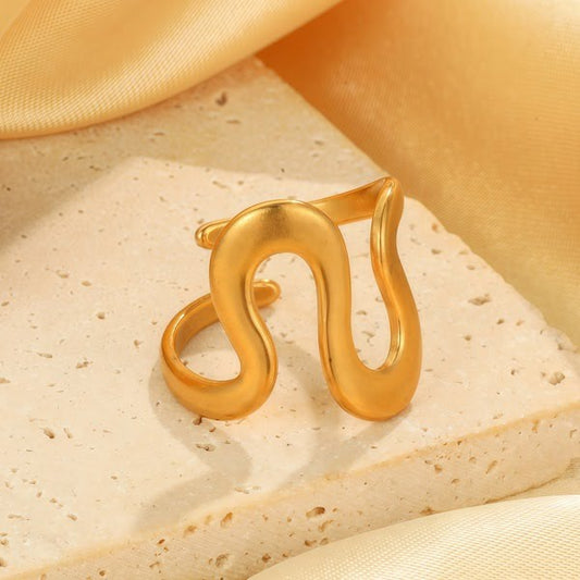 Gold-plated wavy statement ring.