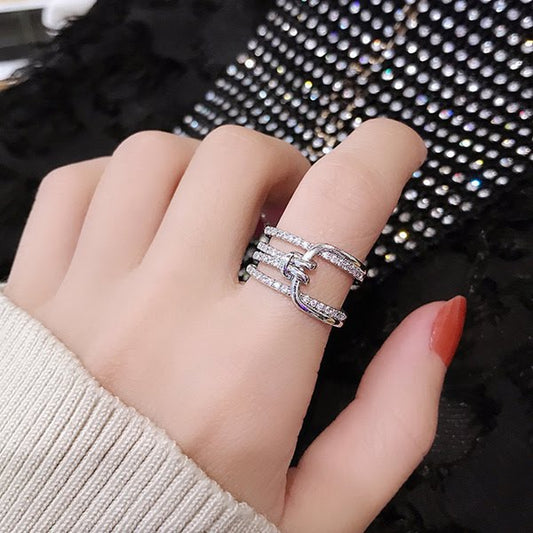 Multi-layered crystal-encrusted statement ring.