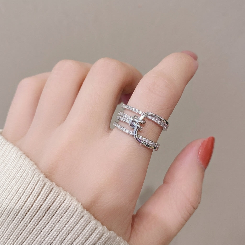 Multi-layered crystal-encrusted statement ring.