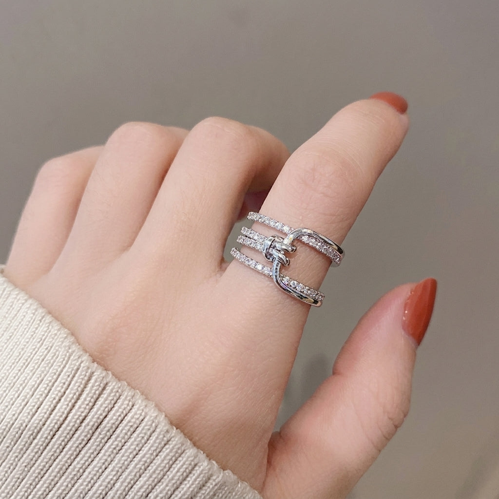 Multi-layered crystal-encrusted statement ring.