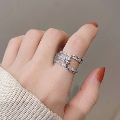 Multi-layered crystal-encrusted statement ring.