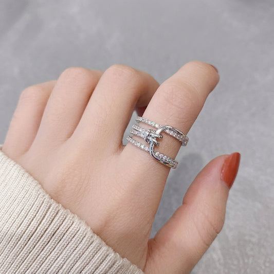 Multi-layered crystal-encrusted statement ring.