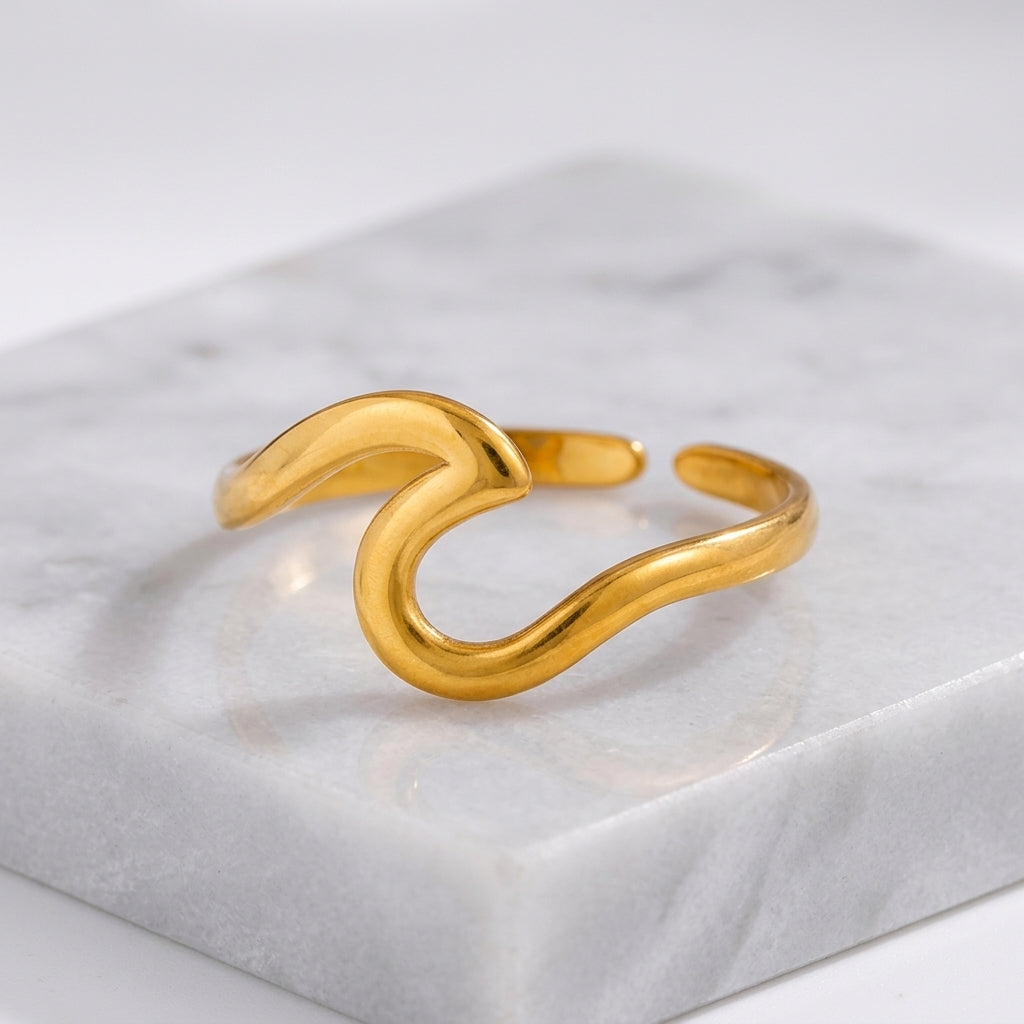 Gold-plated adjustable wave ring.