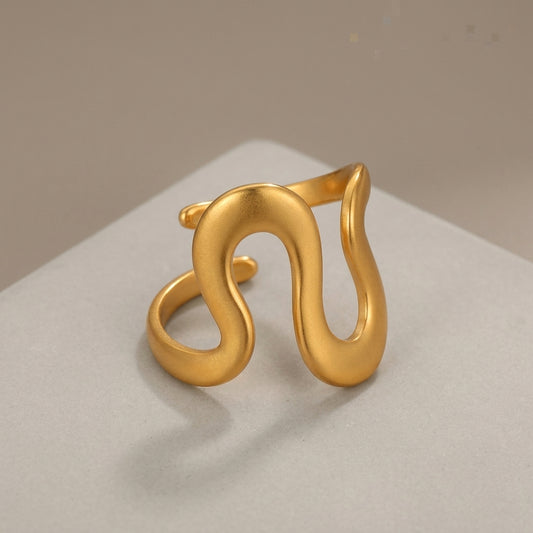 Gold-plated wavy statement ring.