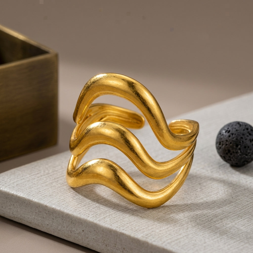 Triple-layer wavy statement ring.