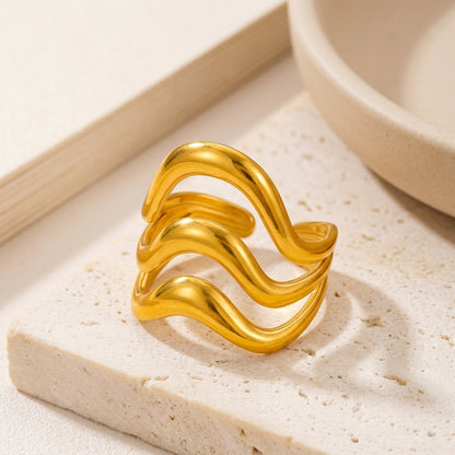 Triple-layer wavy statement ring.